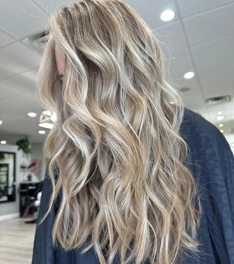 Very long blonde hair with dimensional waves at Palm Beach Hair Co.