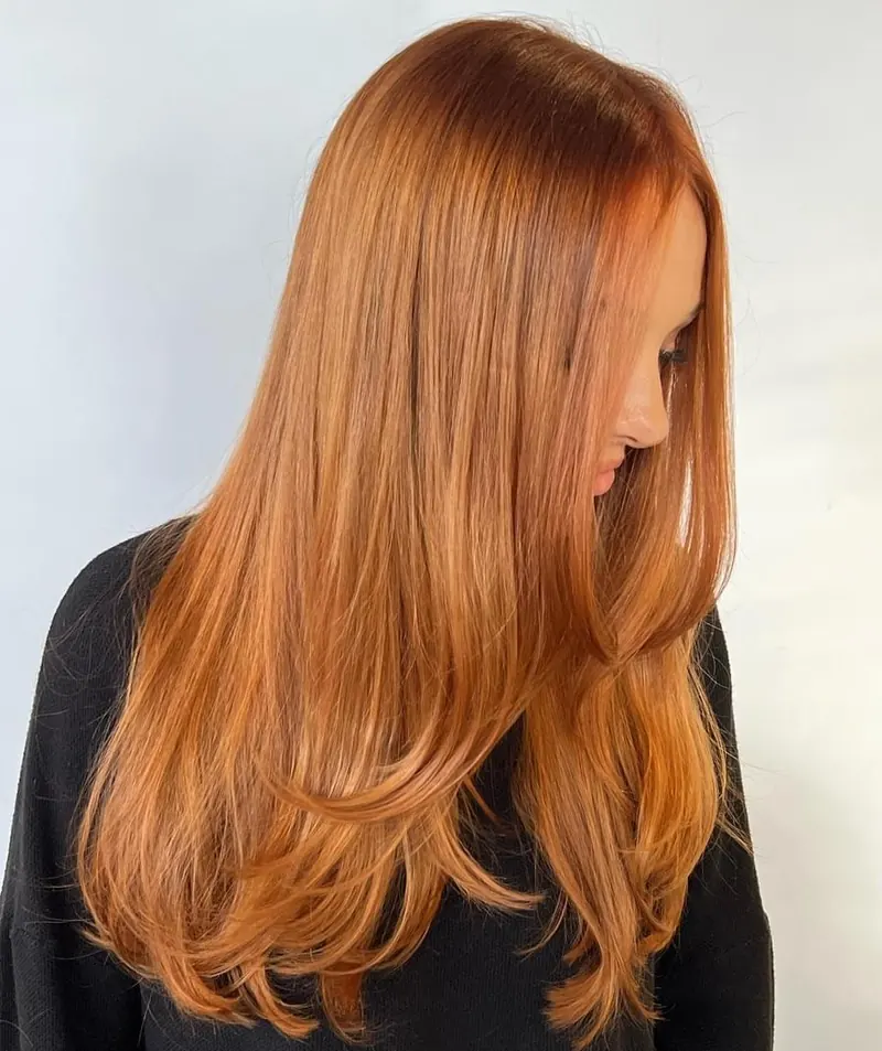 Long copper hair with a smooth finish at Palm Beach Hair Co.