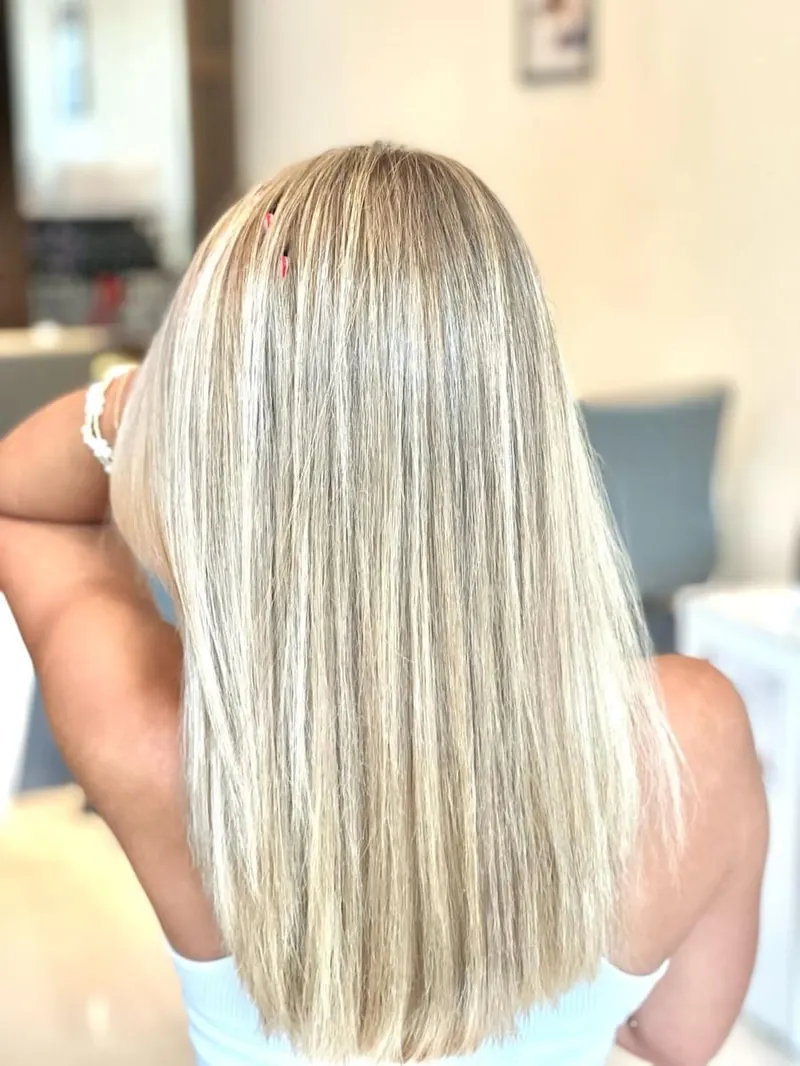 Straight platinum blonde hair, back view, at Palm Beach Hair Co.