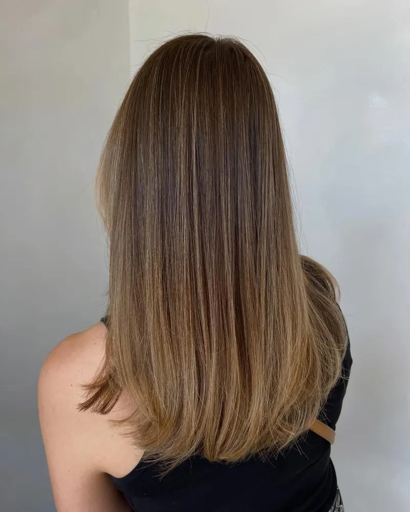 Sleek, straight, glossy hair after a smoothing treatment at Palm Beach Hair Co.